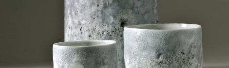 porcelain pots with worn grey volcanic glaze